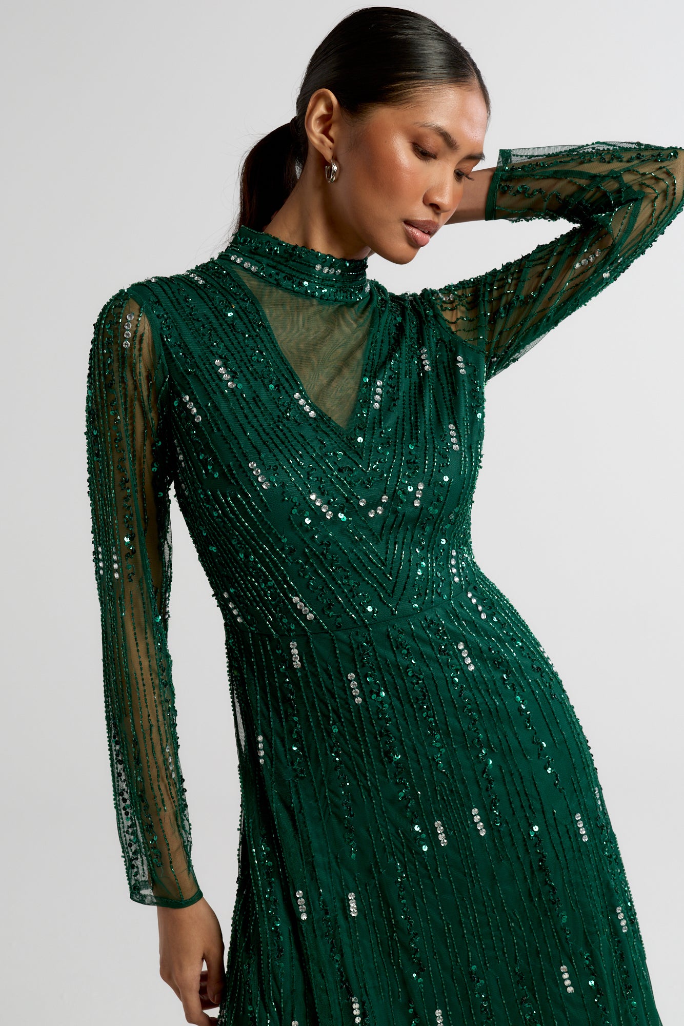 Sophia green high neck embellished maxi dress with full length sleeves and intricate embellishment, suitable for weddings and formal occasions.