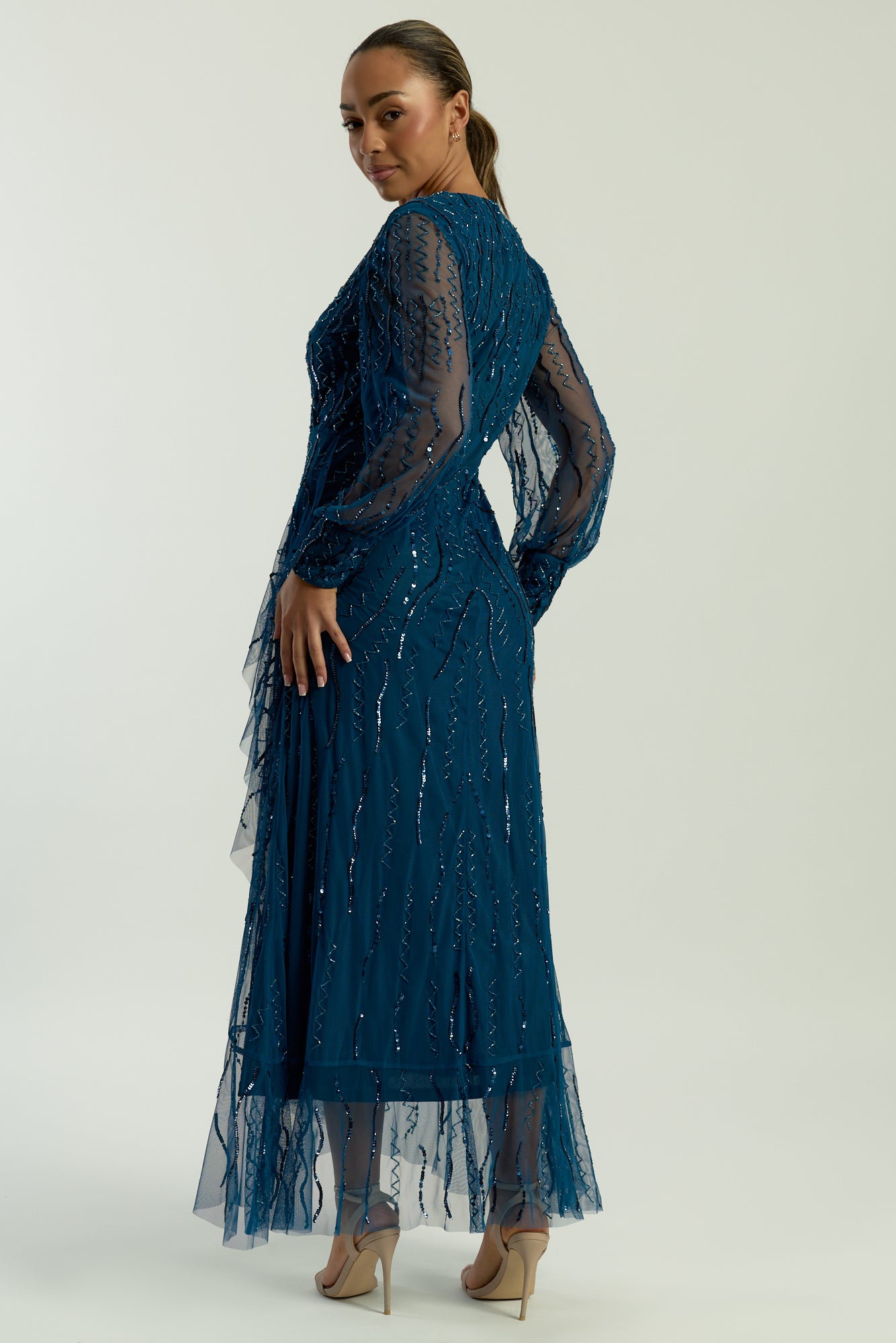 Velora skipper blue sequin midi dress with V-neckline, long sleeves, and fit-and-flare silhouette, perfect for evening events, weddings, and parties.