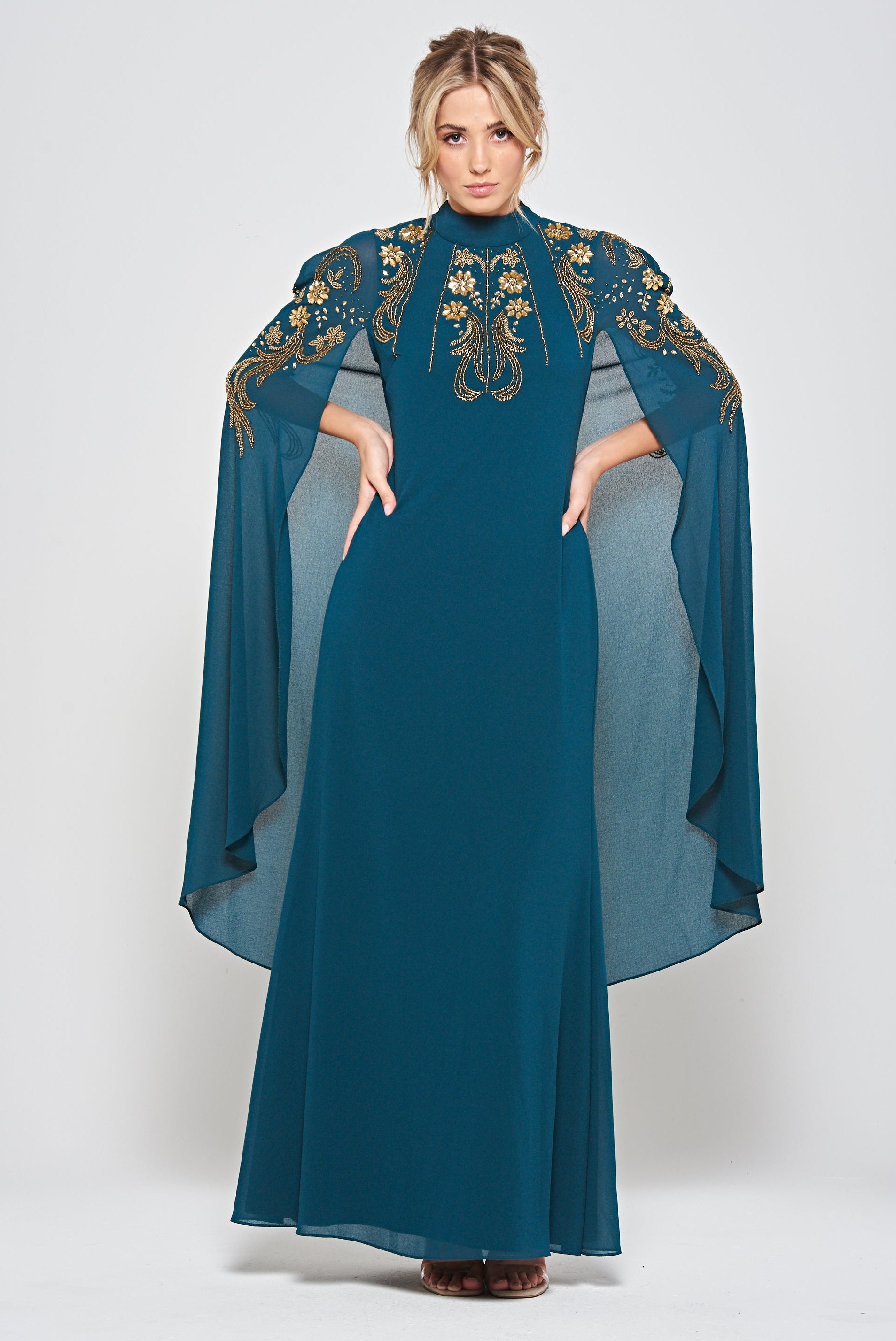 Zinnia dark green embellished cape sleeve maxi dress with high neckline and flowing floor-length skirt, elegant modest evening gown for weddings and formal occasions.