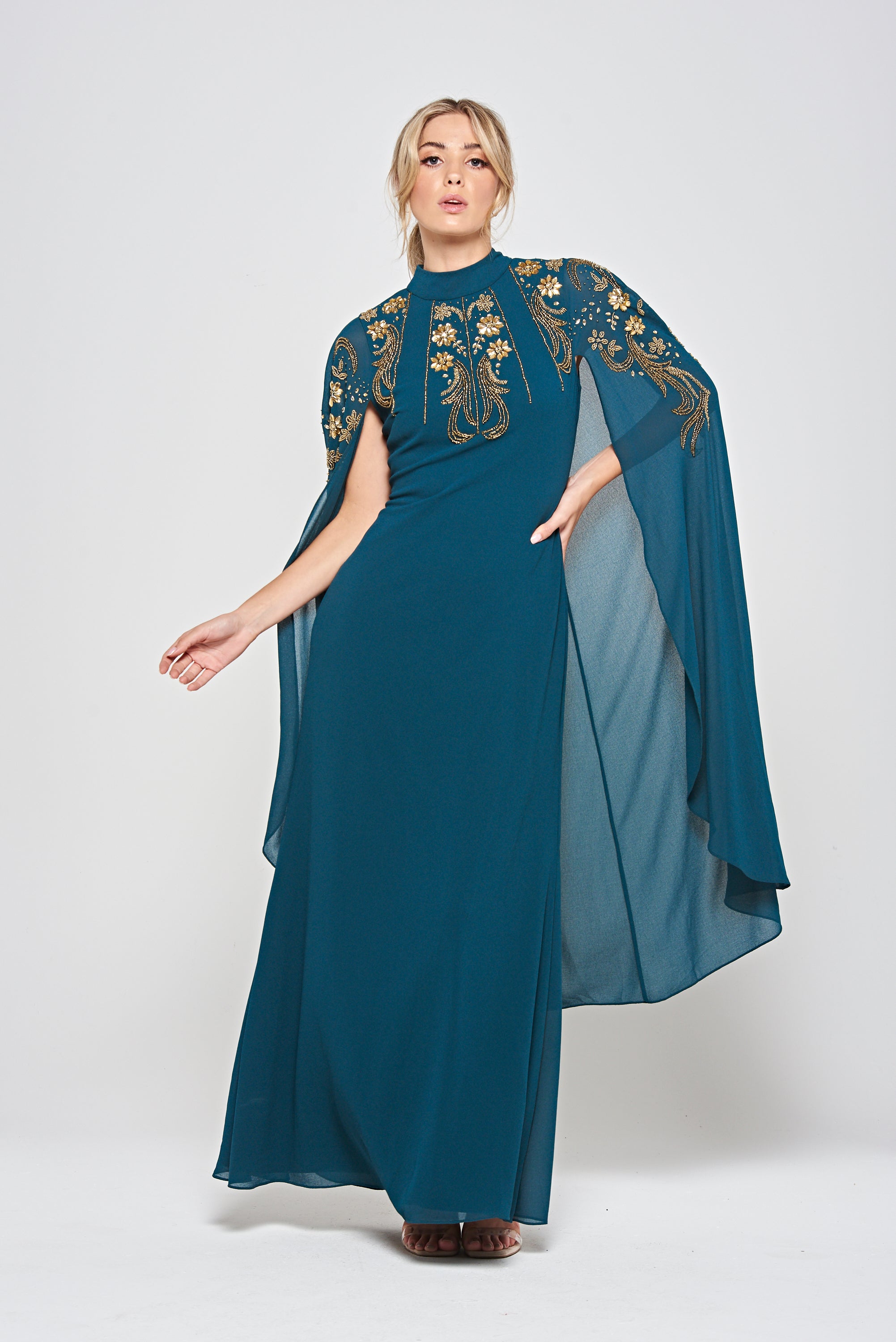 Zinnia dark green embellished cape sleeve maxi dress with high neckline and flowing floor-length skirt, elegant modest evening gown for weddings and formal occasions.